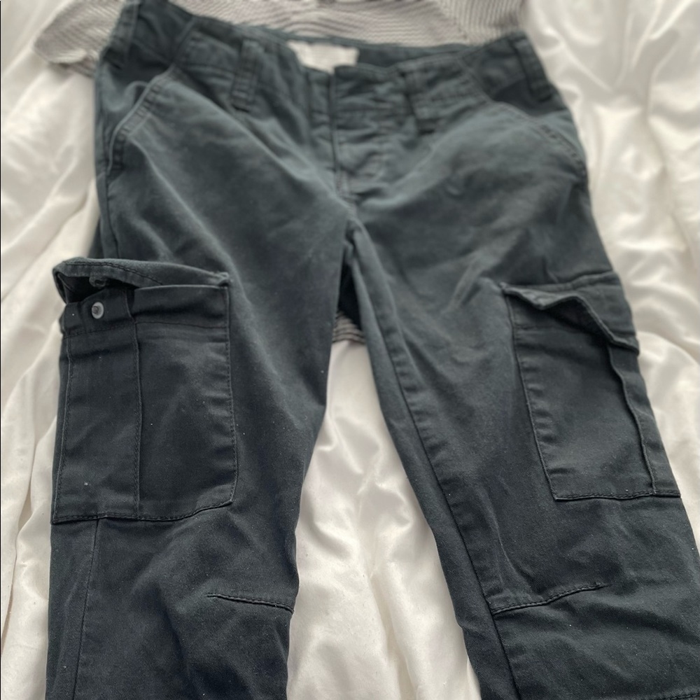 Free People Black cargo pants size: 26
3 buttons fly and a zipper on the bottom